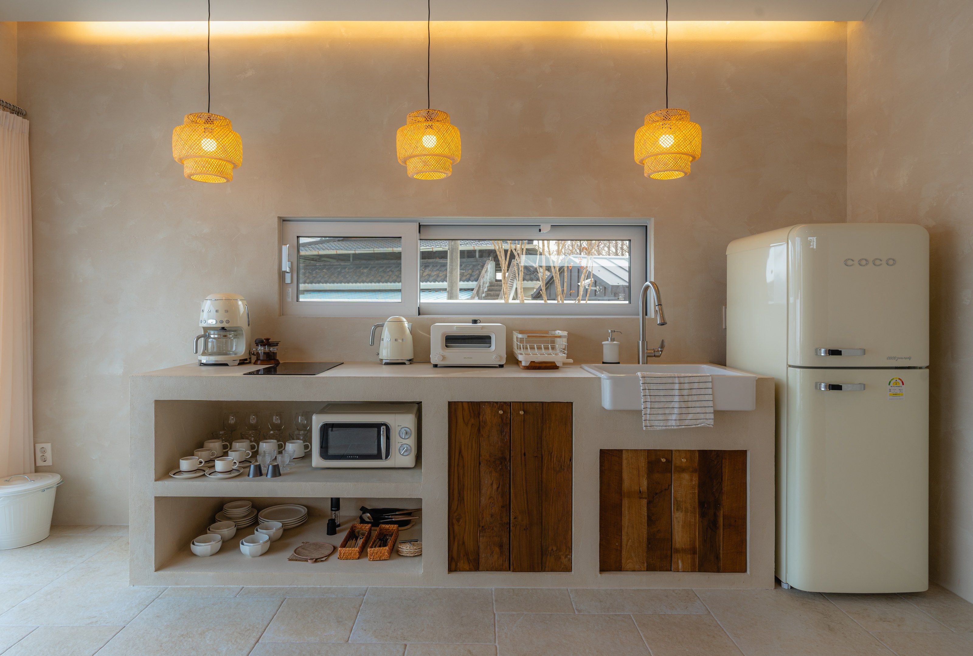 Kitchen with pendant lights and SMEG fridge