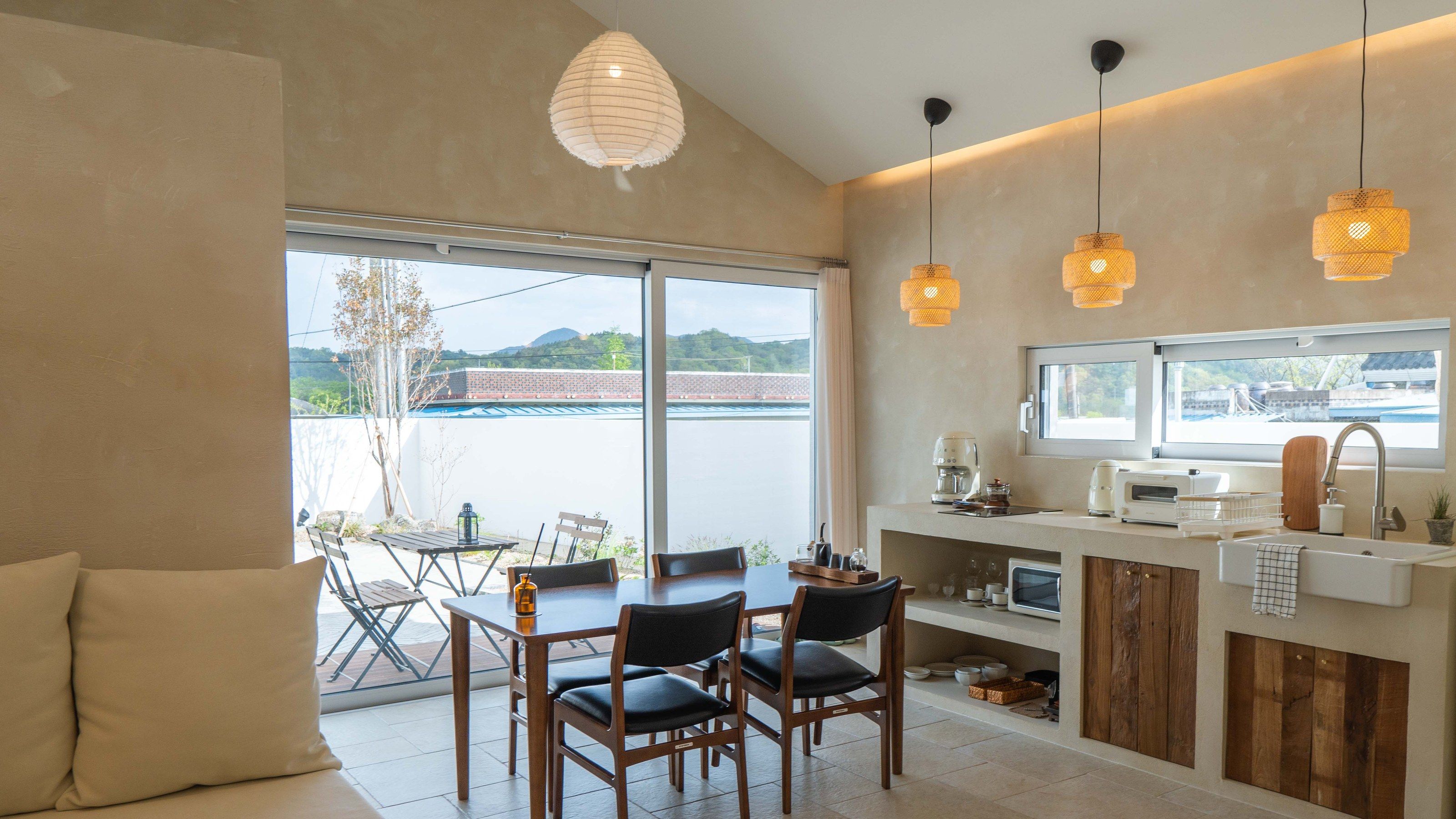 LAZE B dining and kitchen opening to the garden