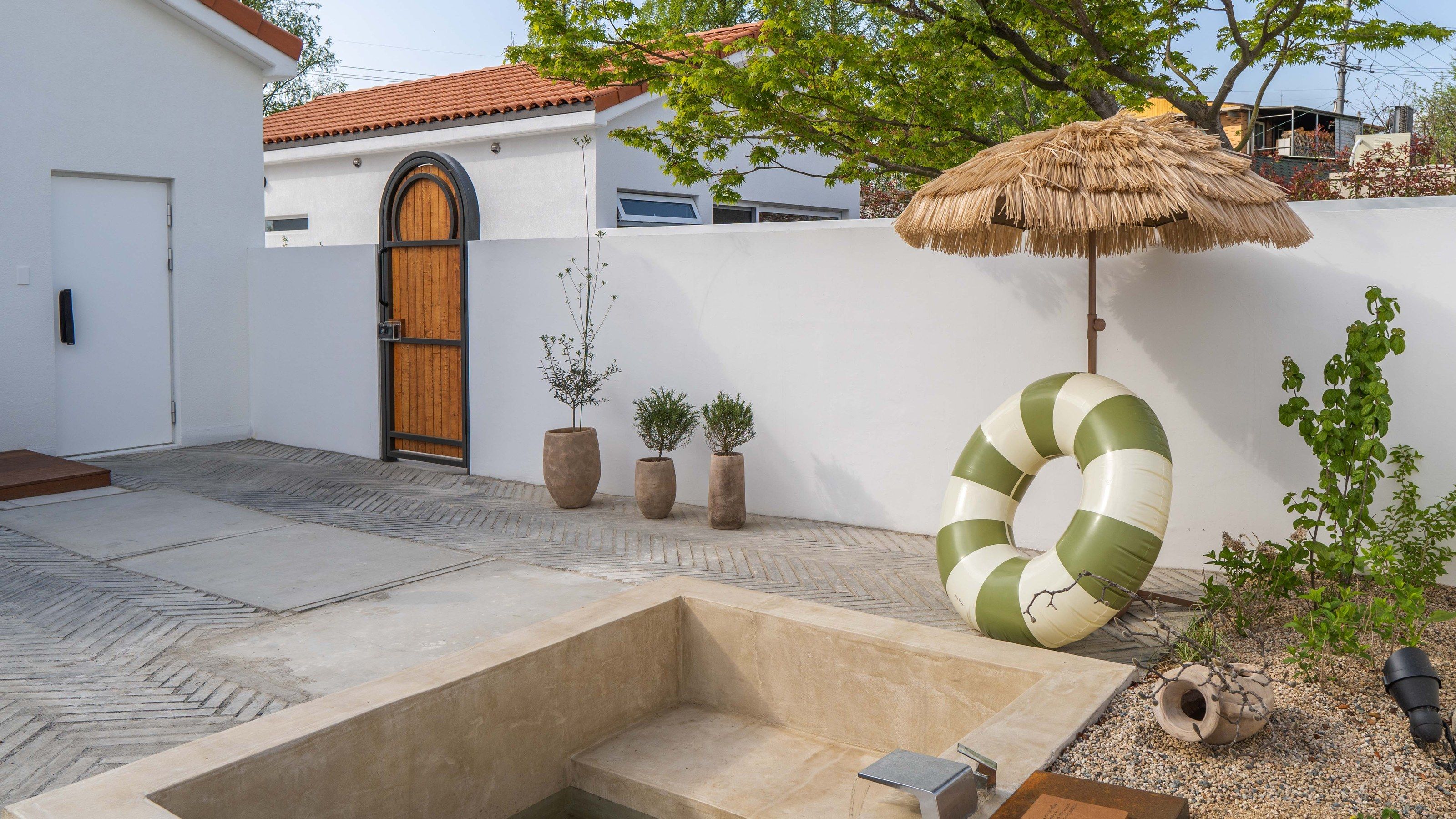 Private garden with outdoor jacuzzi and parasol
