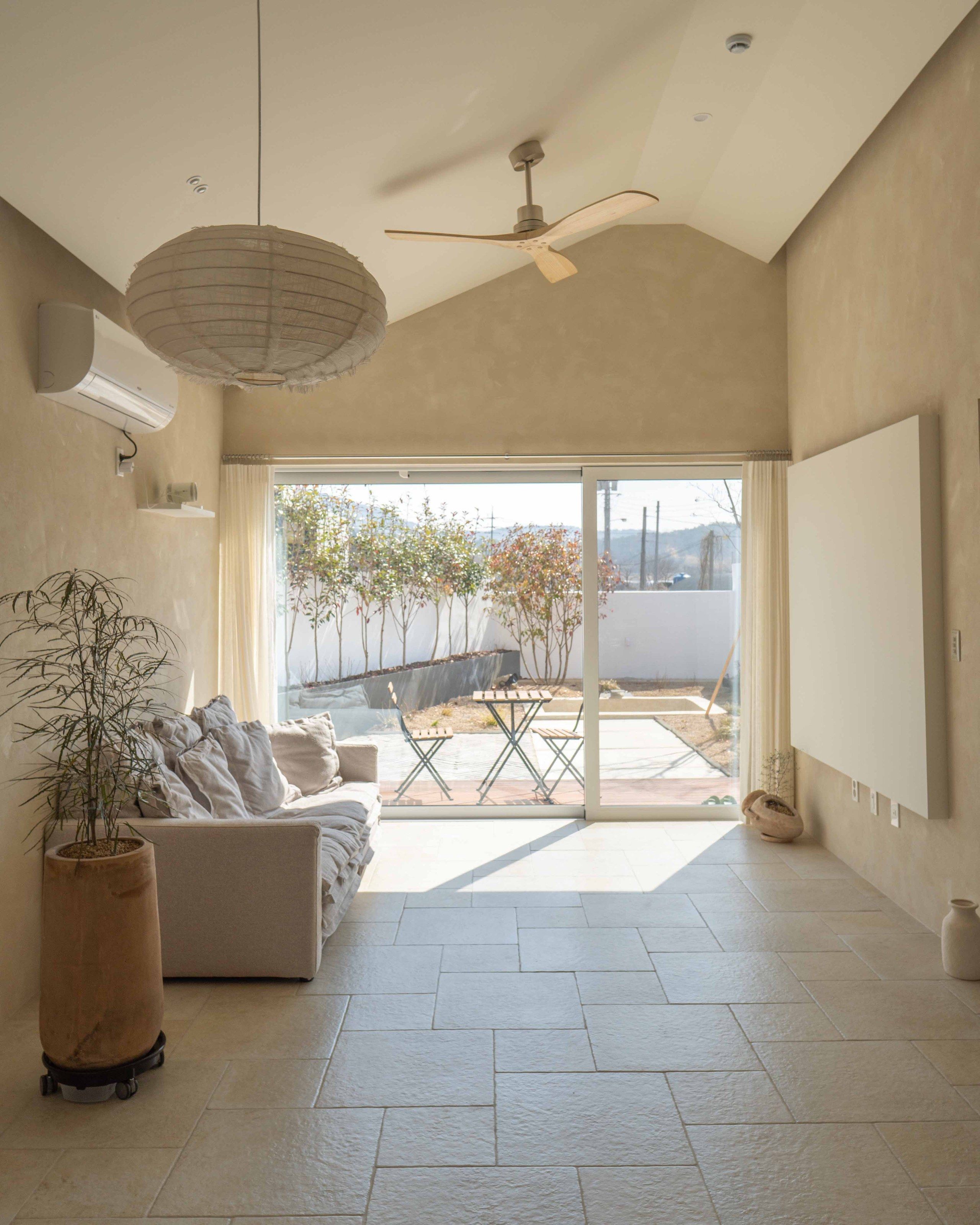 LAZE A living room with sofa and ceiling fan