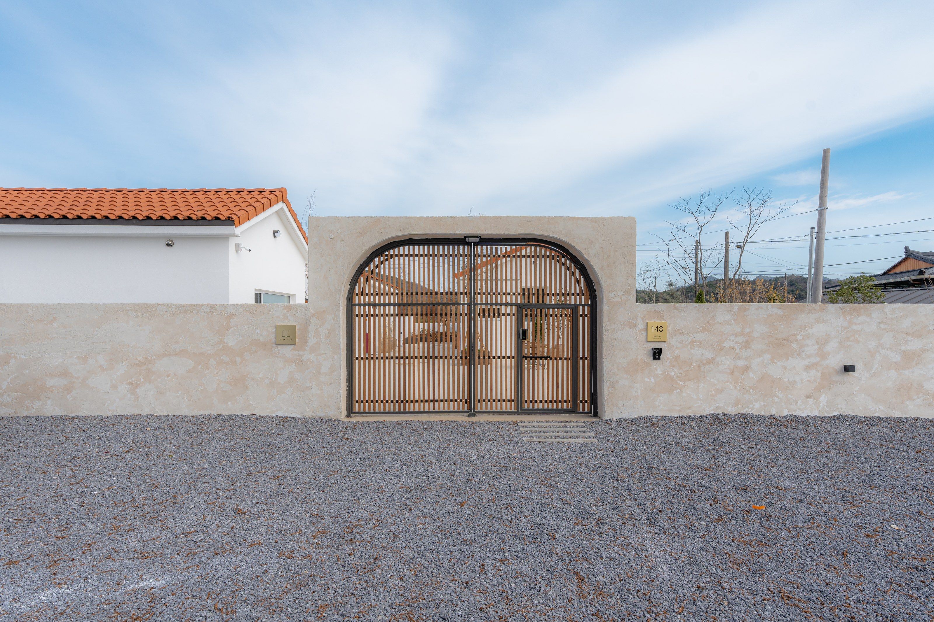 The LAZE wall with its arched gate